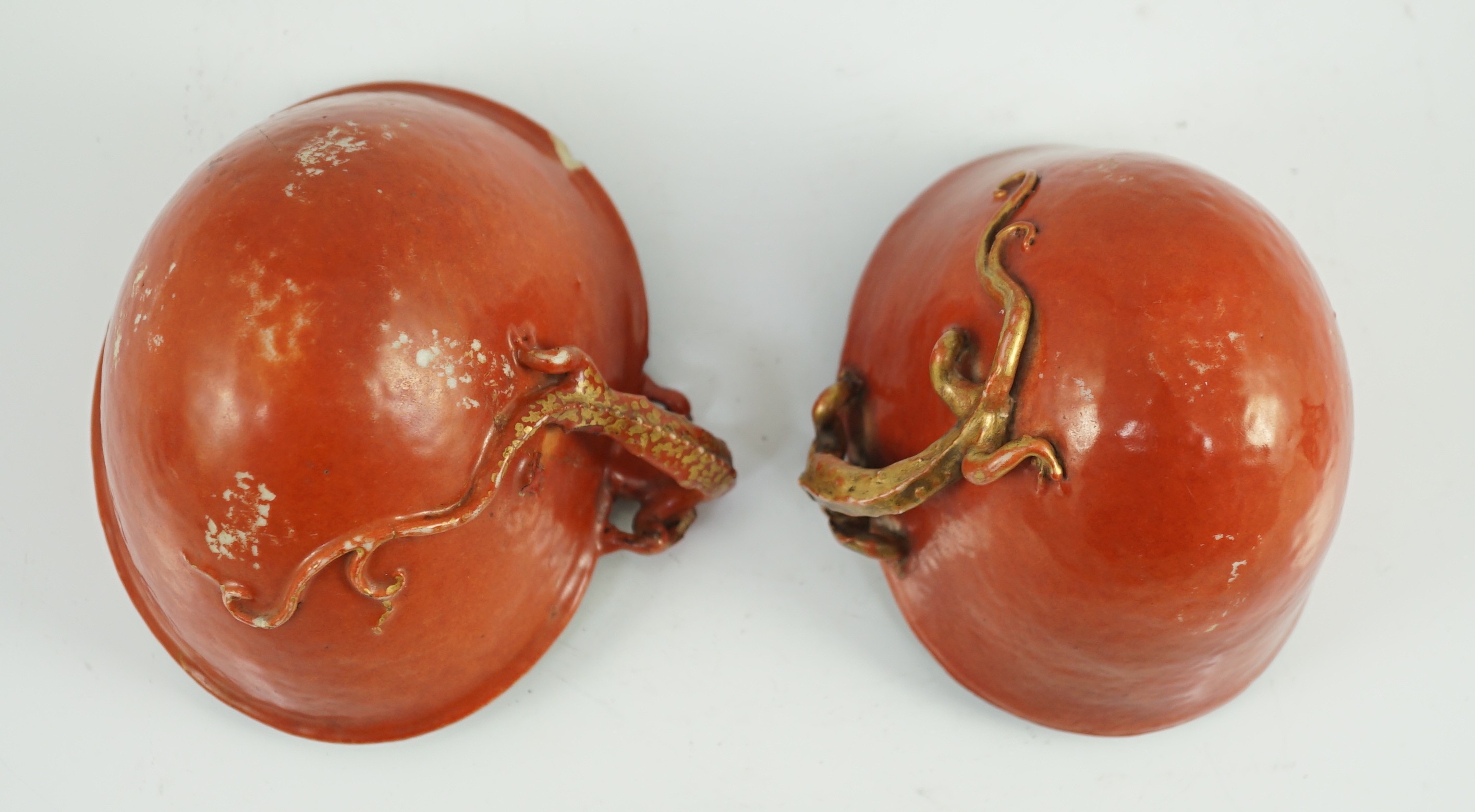 Two similar Chinese coral ground libation cups, late 18th/early 19th century, 10.5cm and 11.5cm across, wood stands